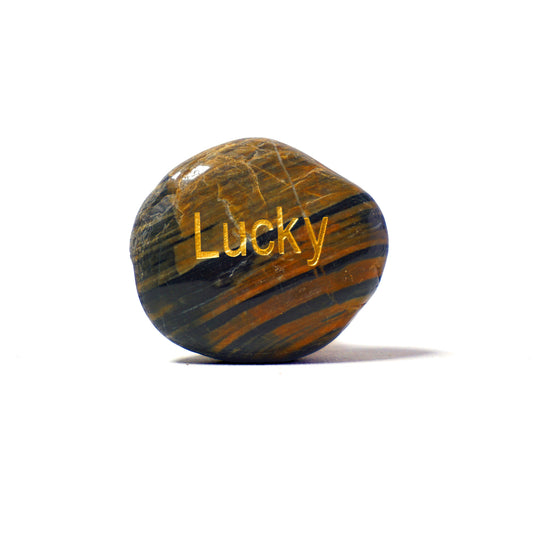 Marbled stone with 'Lucky' engraved on a white background