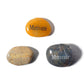 Three stones with 'Motivate' engraved on them on a white background