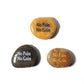 Three stones with 'No Pain No Gain' text in different colors on a white background