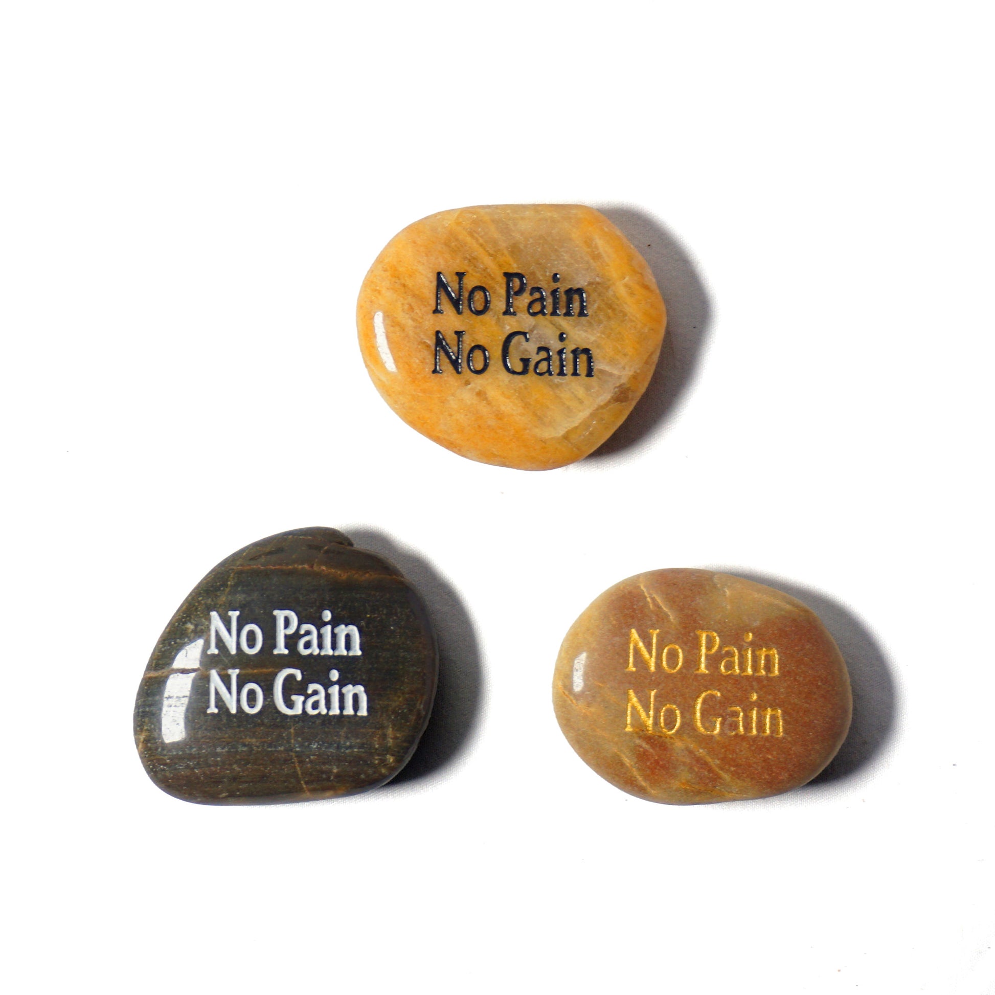 Three stones with 'No Pain No Gain' text in different colors on a white background