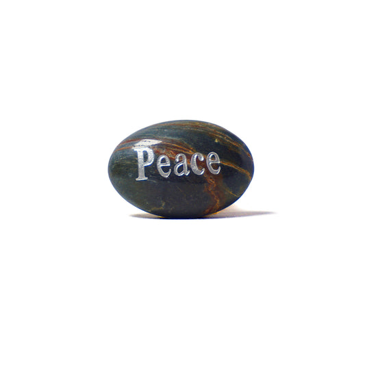 Decorative stone with 'Peace' engraved on a white background