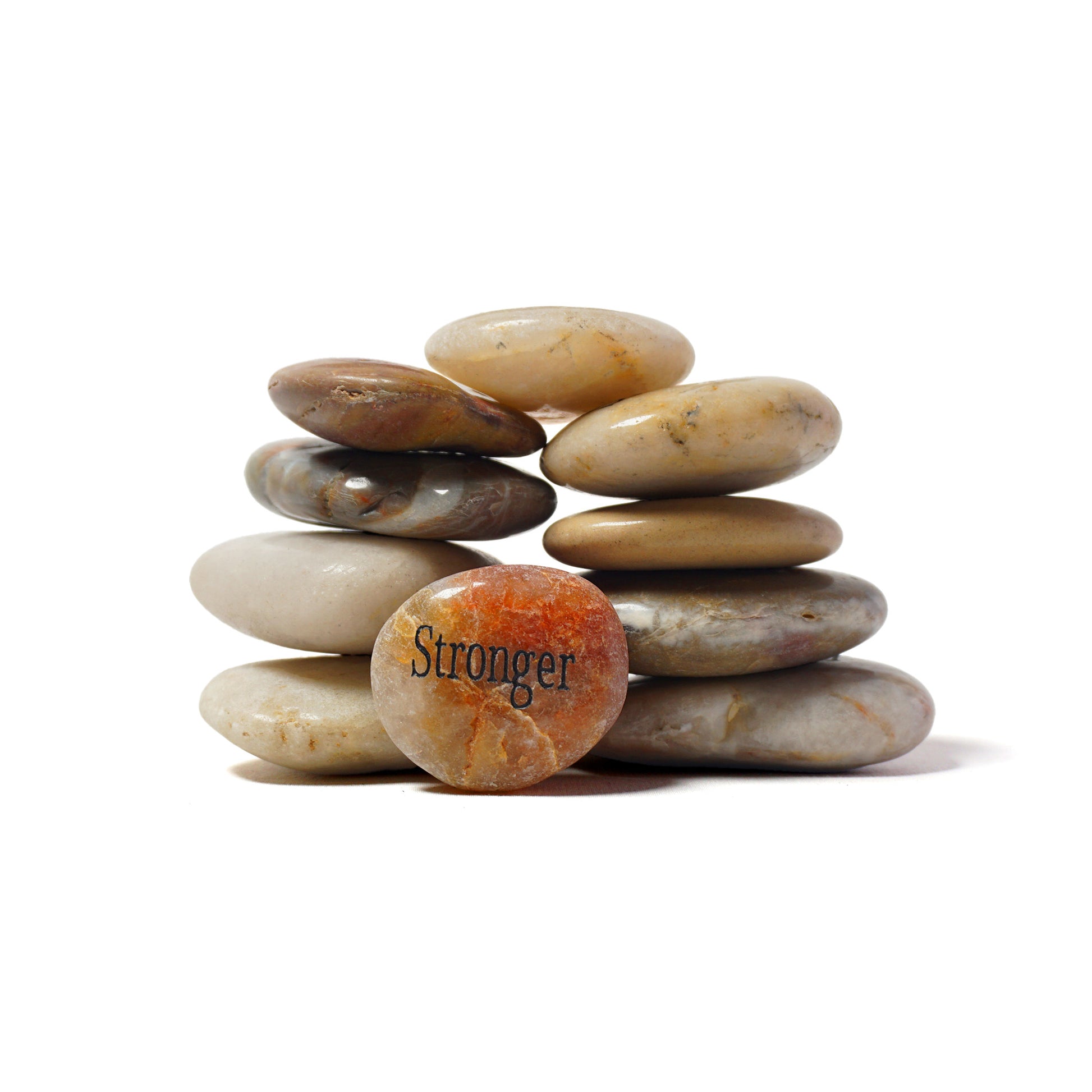 Stack of stones with 'Stronger' engraved on a white background