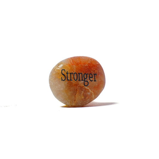 Round stone with 'Stronger' engraved on a white background