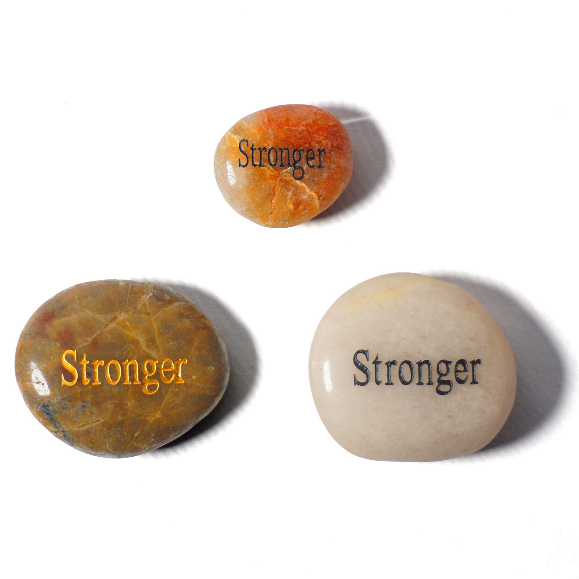 Three stones with 'Stronger' engraved on them on a white background
