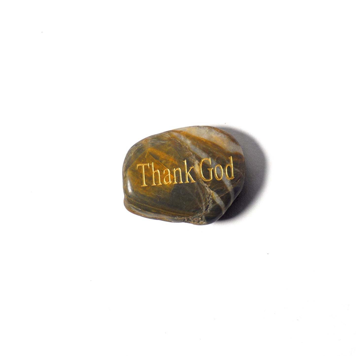 Marble-textured stone with 'Thank God' engraving on a white background