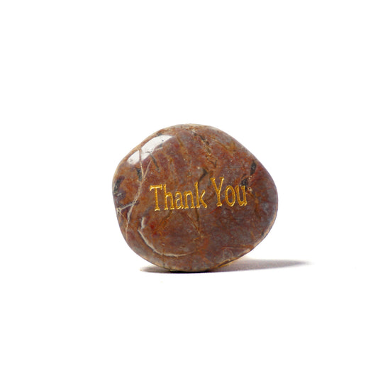 Brown stone with 'Thank You' engraved on a white background