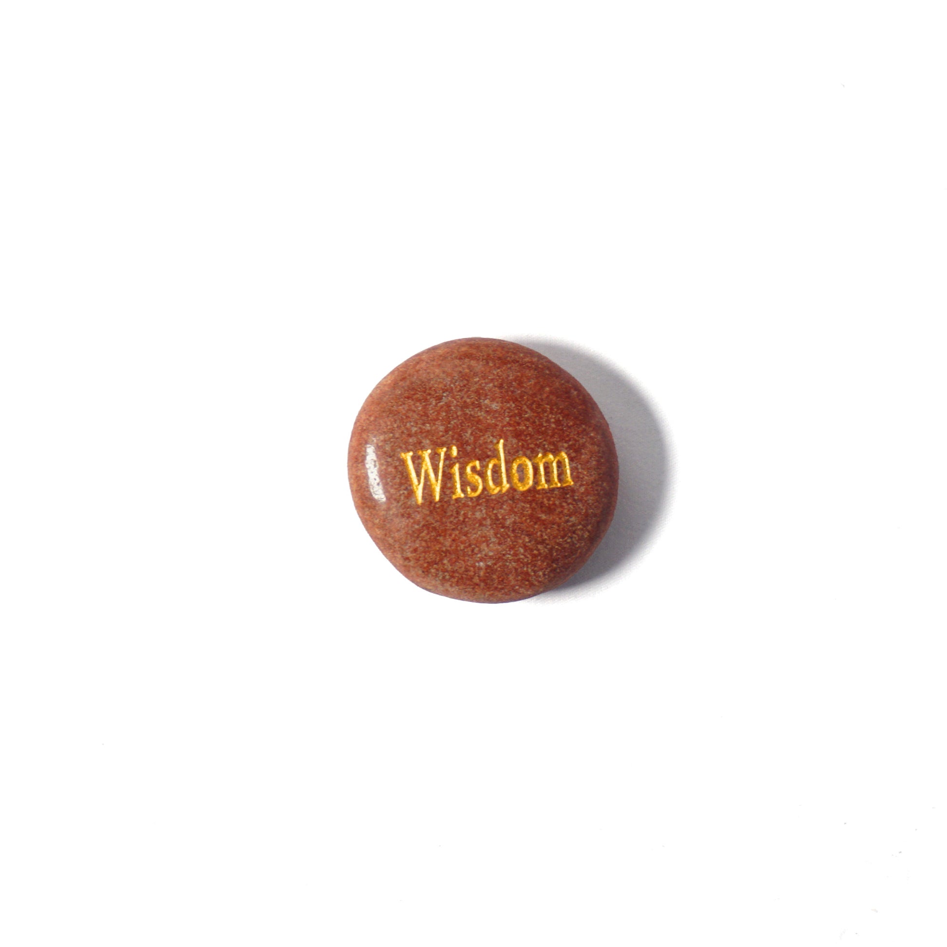 Brown stone with 'Wisdom' engraved on a white background