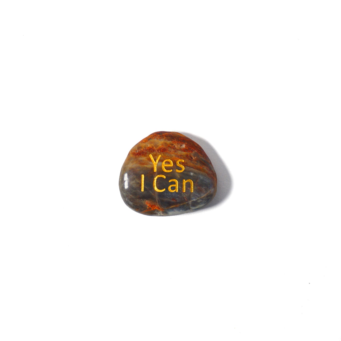 Rough stone with 'Yes I Can' engraved on a white background